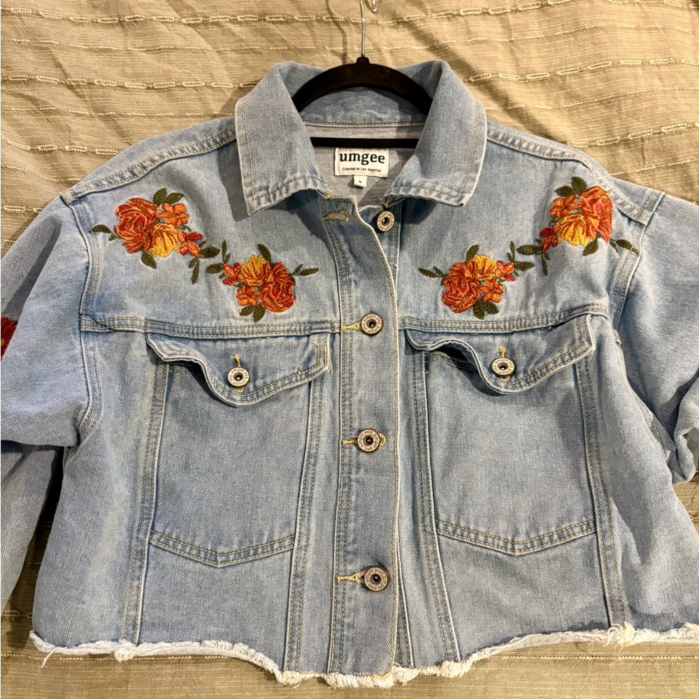 Umgee Cropped Jean Jacket with pink and yellow Floral Embroidery.